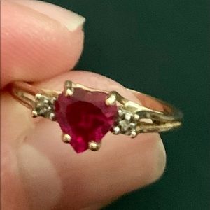 Heart shaped Ruby with 2 diamonds in 10k yellow gold ring